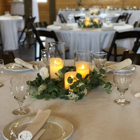 decorated table with candles and dinnerware